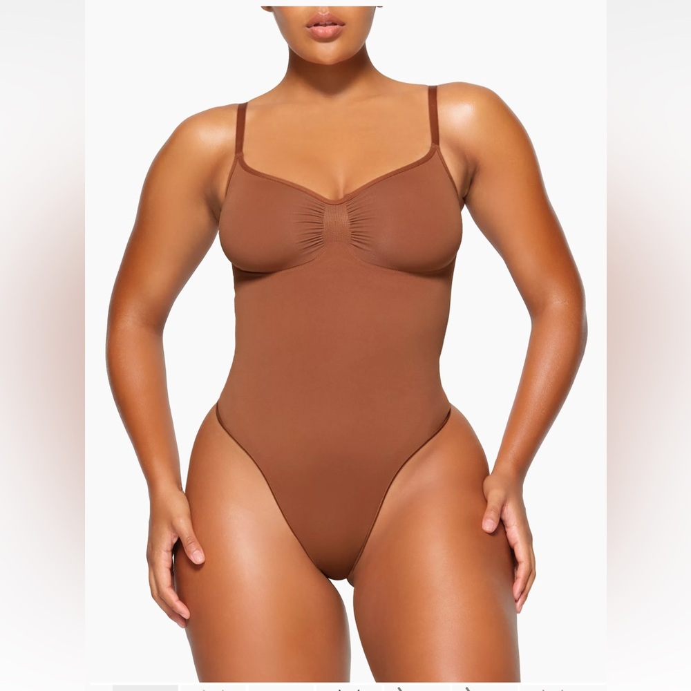 SKIMS Seamless Sculpt Thong Bodysuit. Color Bronze